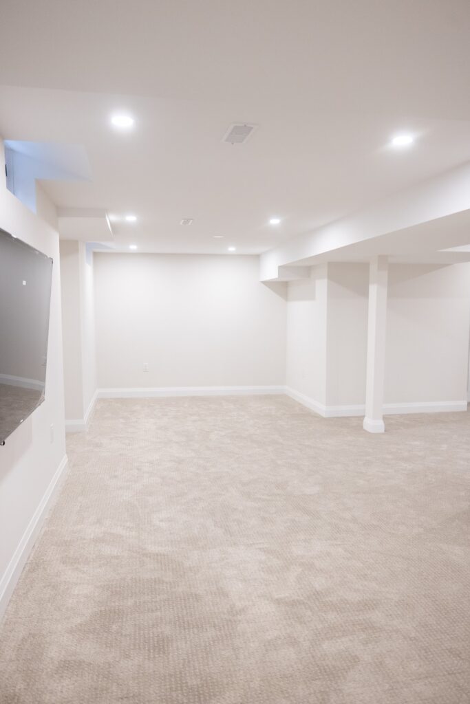 Renovated basement living space with pot lights