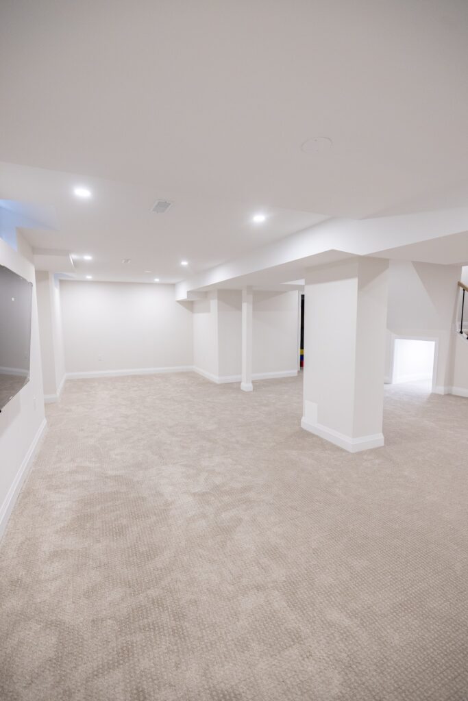 Finished basement with new flooring and lighting