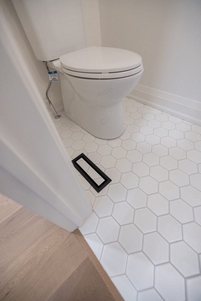 Powder room renovation with custom finishes